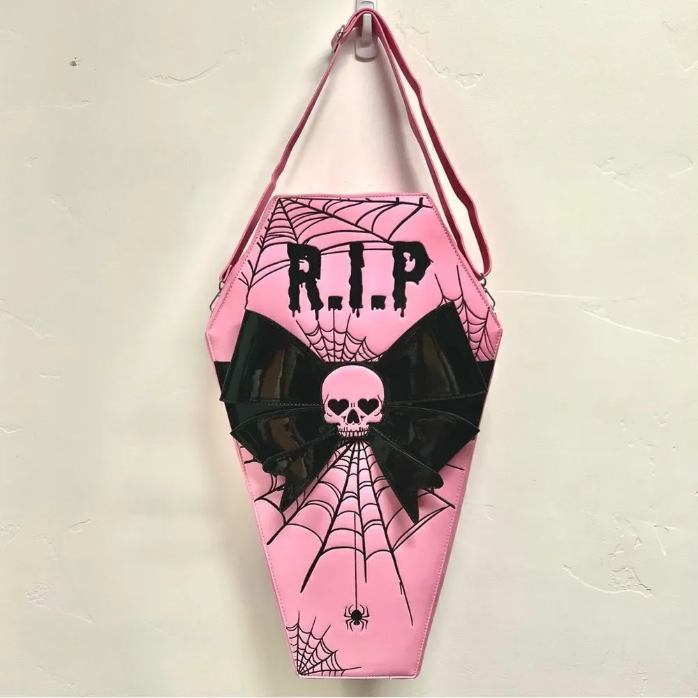 Dolls Kill oversize pink and black skull spiderweb coffin backpack. New in box